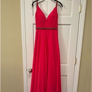 Hot pink gown with bead detailing at waist and on straps.
